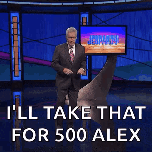 a man in a suit and tie on a jeopardy show