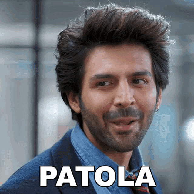 a man with a beard is wearing a blue shirt and a blue jacket and has patola written on his face