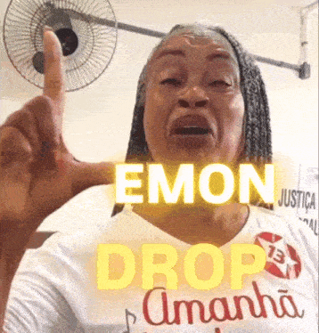 a woman in a white shirt with the words emon drop amanda on it