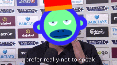 a man with a green monkey on his face says " i prefer really not to speak "