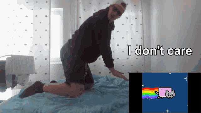 a man kneeling on a bed with the words i don 't care