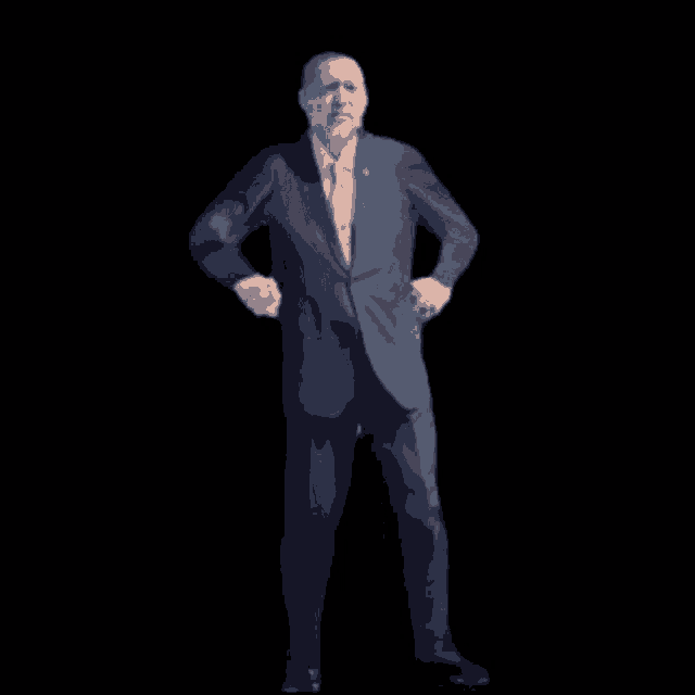 a man in a suit and tie is dancing