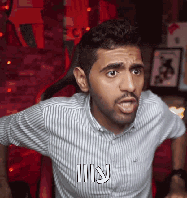 a man in a striped shirt with the word kill written on his chest