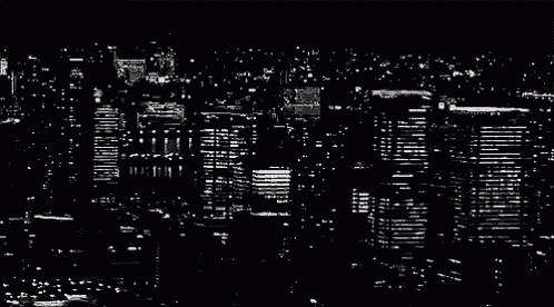 a black and white aerial view of a city at night
