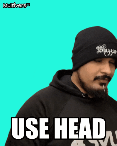 a man with a beard wearing a black beanie says use head