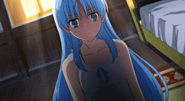 a girl with blue hair is sitting in a room