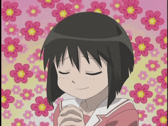 a girl with her eyes closed in front of a floral background