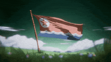 a korean flag is waving in the wind in a field