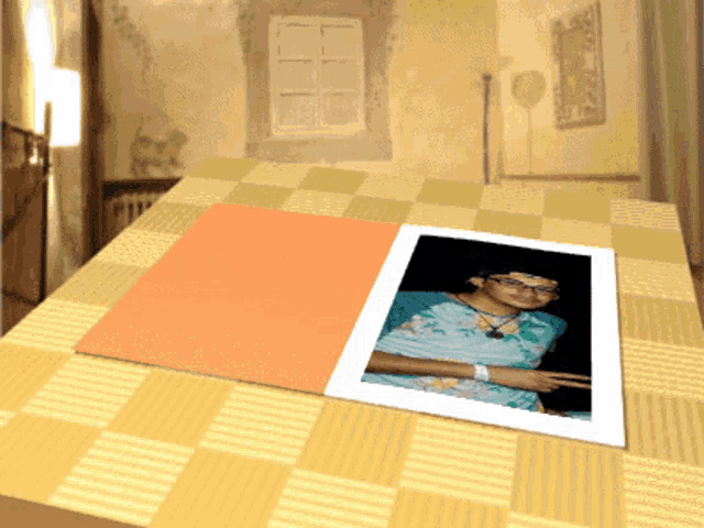 a picture of a woman sitting on a checkered tablecloth