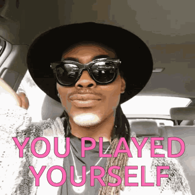 a man wearing sunglasses and a hat with the words you played yourself on the bottom