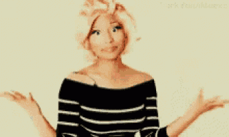 a woman wearing a black and white striped shirt is shrugging her shoulders .