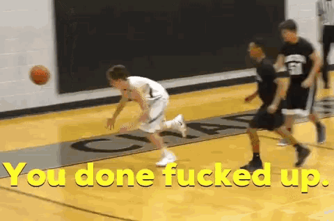a basketball game is being played with the words " you done fucked up " on the bottom