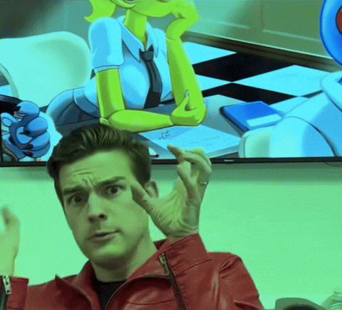 a man in a red jacket is giving a thumbs up in front of a cartoon character