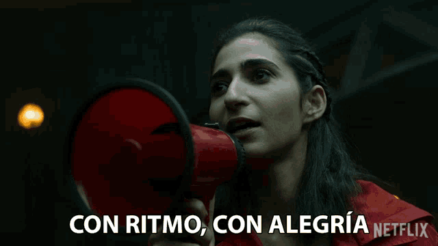 a woman holding a megaphone with the words con ritmo con alegria