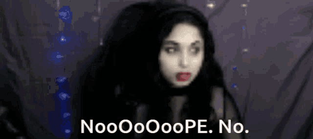a blurry picture of a woman with the words nooooope no.