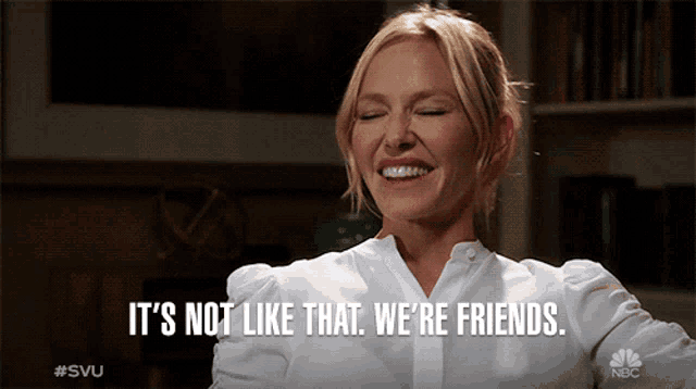a woman says it 's not like that we 're friends while smiling
