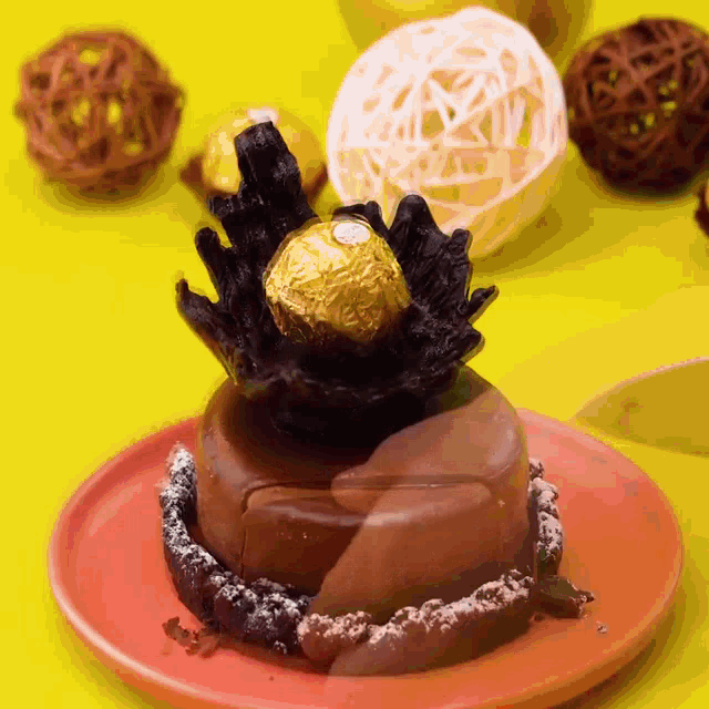 a cake with a ferrero rocher on top of it