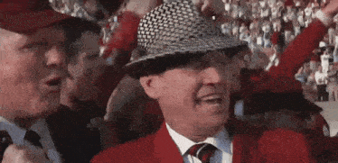 a man in a hat says he must be the stupidest son of a bitch alive in front of a crowd