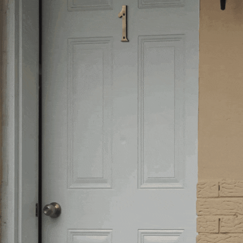 a white door with a number 1 on it