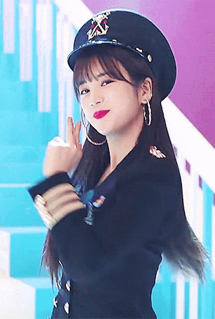 a woman wearing a hat with a x on it