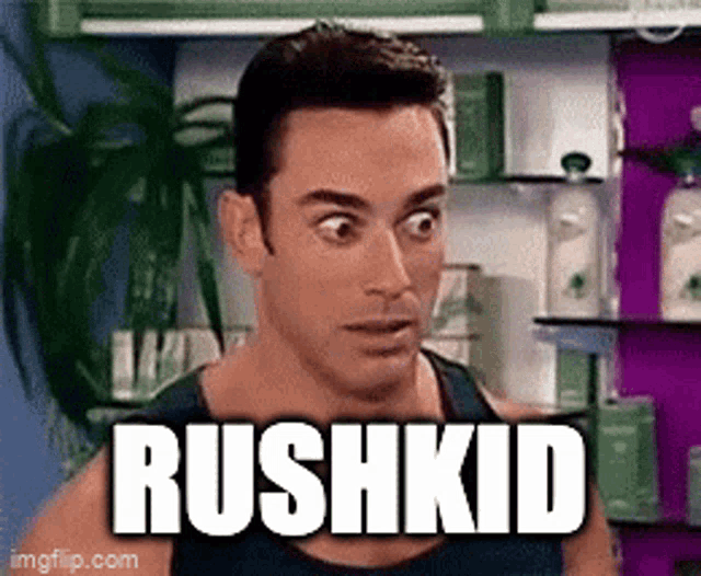 a man with a surprised look on his face and the word rushkid written on his chest .