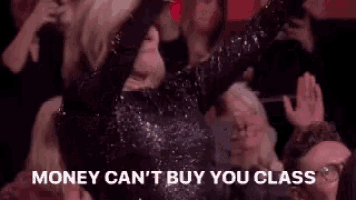 a group of people are standing around a woman who is screaming .