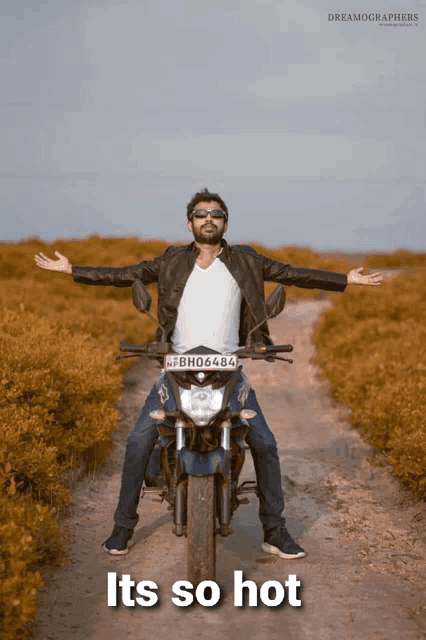 a man sitting on a motorcycle with a license plate that says bh06404