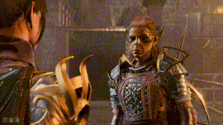 a woman in armor is standing next to another woman in armor .