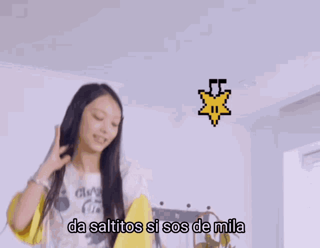 a girl wearing a t-shirt that says clash of clans on it