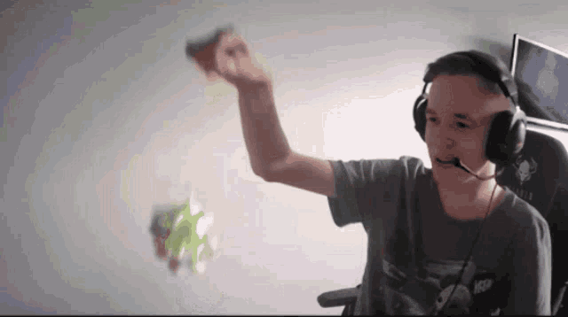 a man wearing headphones and a shirt that says nsfw on it