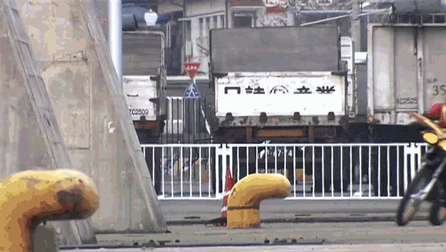 a white truck with chinese writing on the back
