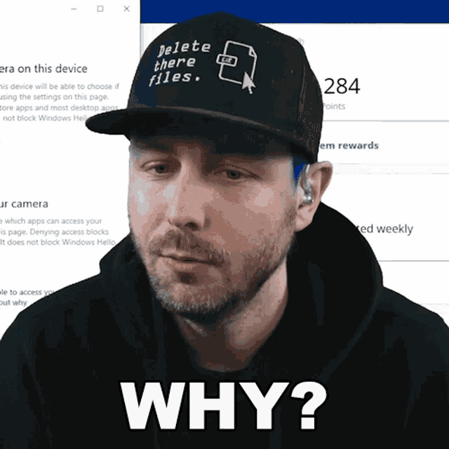 a man wears a hat that says delete there files
