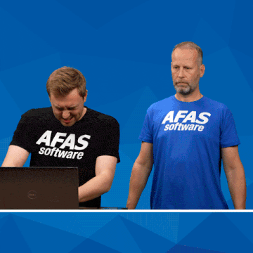a man wearing a afas software shirt holds a sign that says computer says no