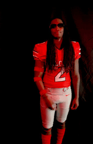 a man in a red jersey with the number 2