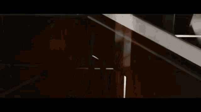 a blurred image of a ceiling with a few lines of light coming through it .
