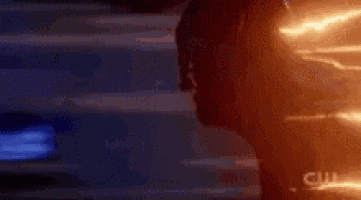 a close up of a person 's face with a blue and red background .