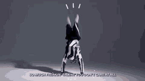 a man is doing a handstand on his head in a dance video .