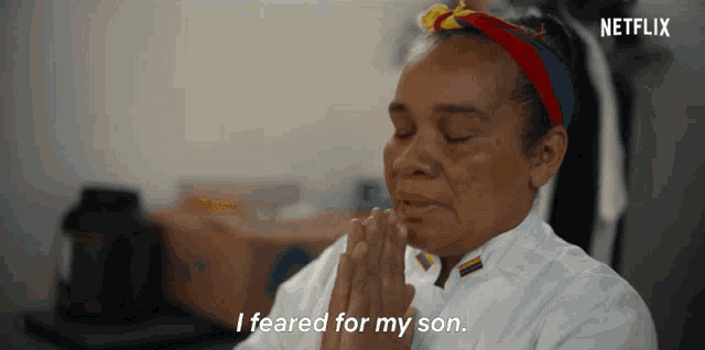a woman praying with the words i feared for my son behind her
