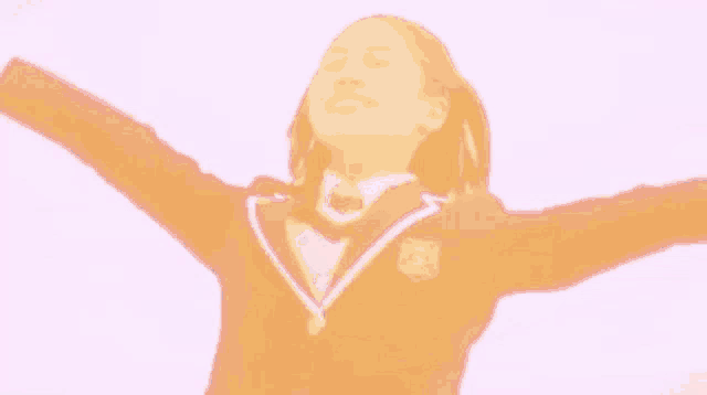 a young girl in a school uniform is flying through the air .