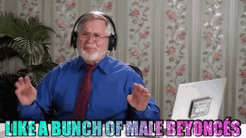 a man wearing headphones and a blue shirt says like a bunch of male beyonces