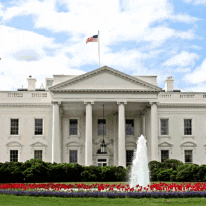 a white house with a flag on top of it