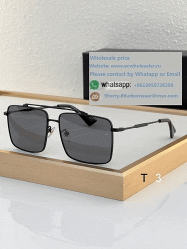 a pair of sunglasses sitting on top of a wooden tray with the number t3 written on it