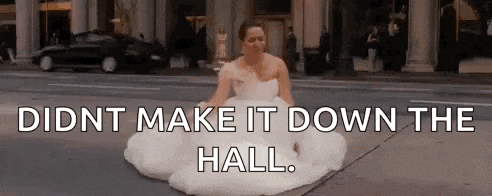 a woman in a wedding dress is sitting on the sidewalk and says `` did n't make it down the hall '' .