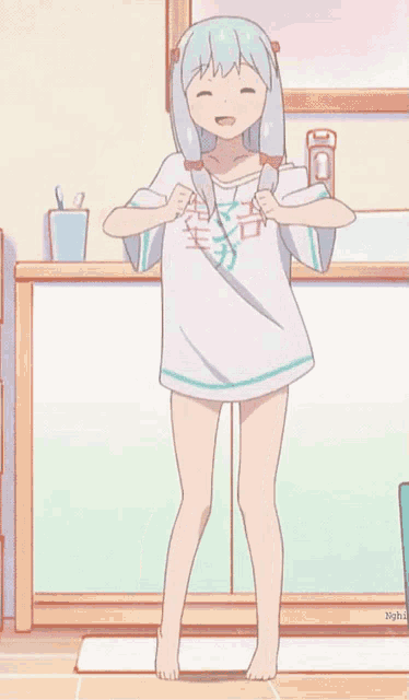 a girl in a white shirt with chinese writing on it is standing in front of a sink