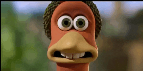 a close up of a cartoon chicken with big eyes and a beanie on .