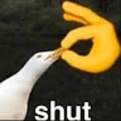 a white bird is eating a yellow finger with the word shut written below it .