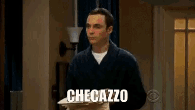a man in a bathrobe is holding a pile of papers and saying checazzo .