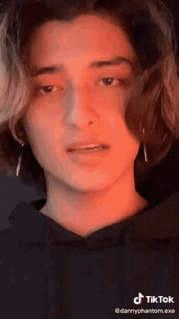 a close up of a person 's face with a tik tok watermark