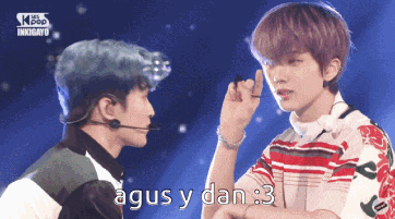 a couple of boys standing next to each other with the words agus y dan : 3 in the corner