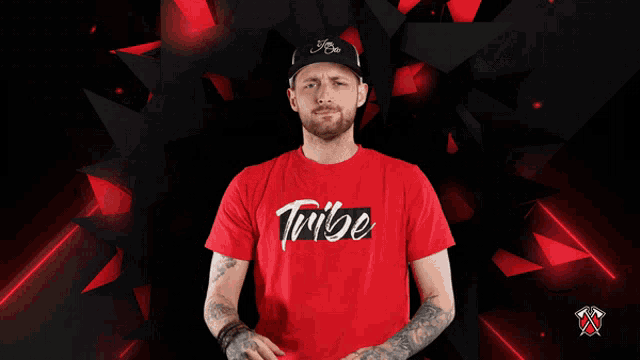 a man wearing a red t-shirt that says tribe